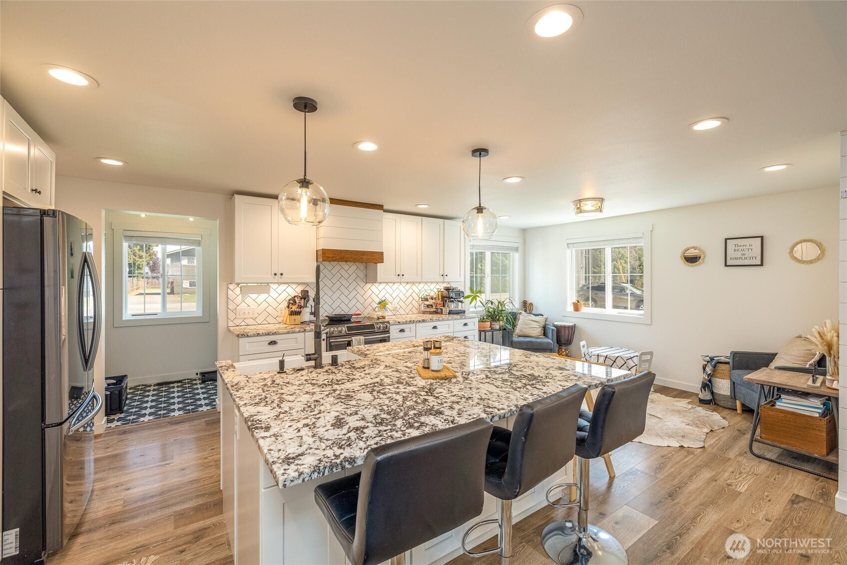 8679 Depot Road Lynden, WA 98264 - Photo 7 of 40 a large kitchen with kitchen island a large counter top space appliances and a center island