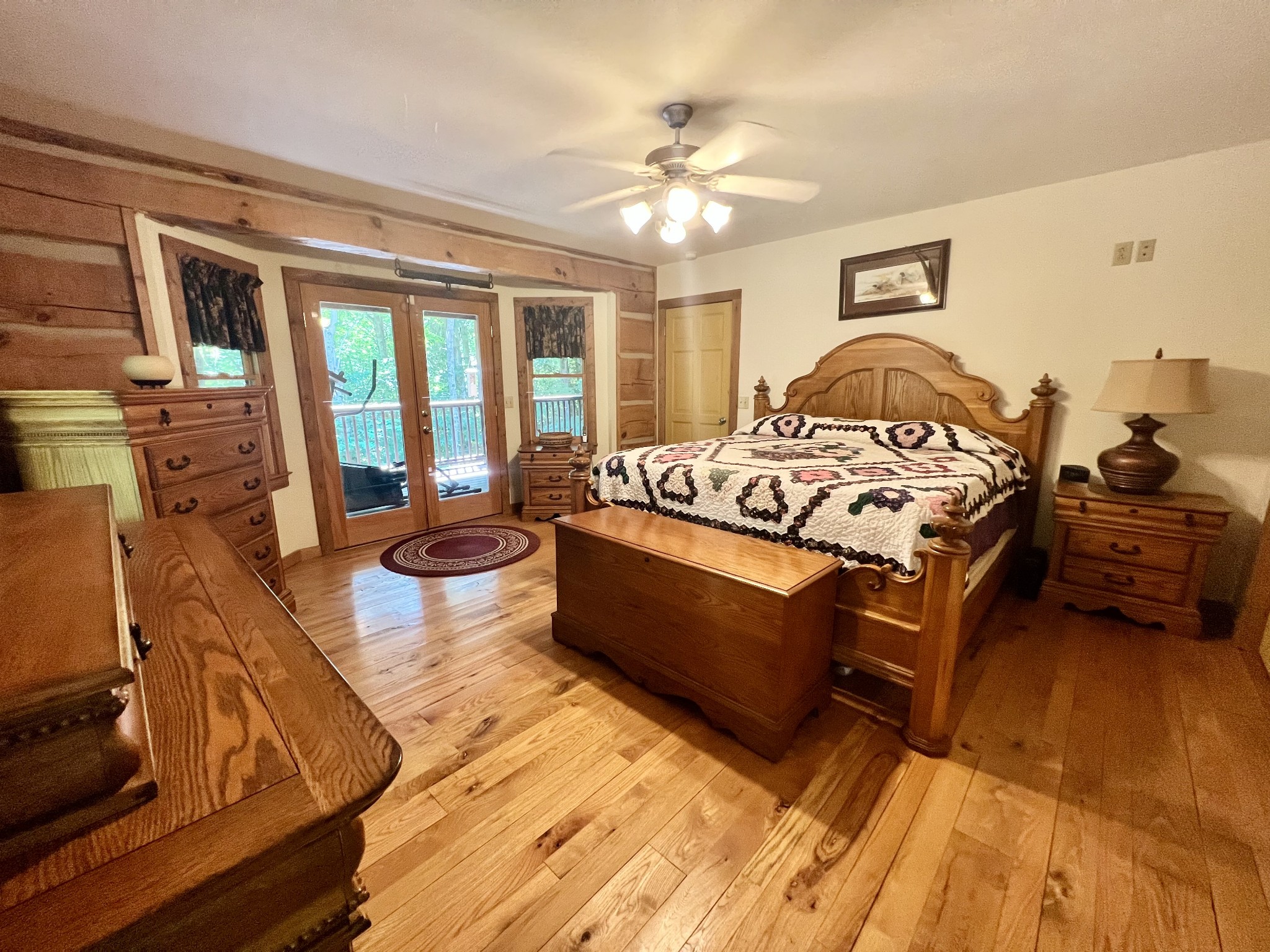 219 Freeland Road Portland, TN 37148 - Photo 34 of 53 a spacious bedroom with a bed a couch and large windows