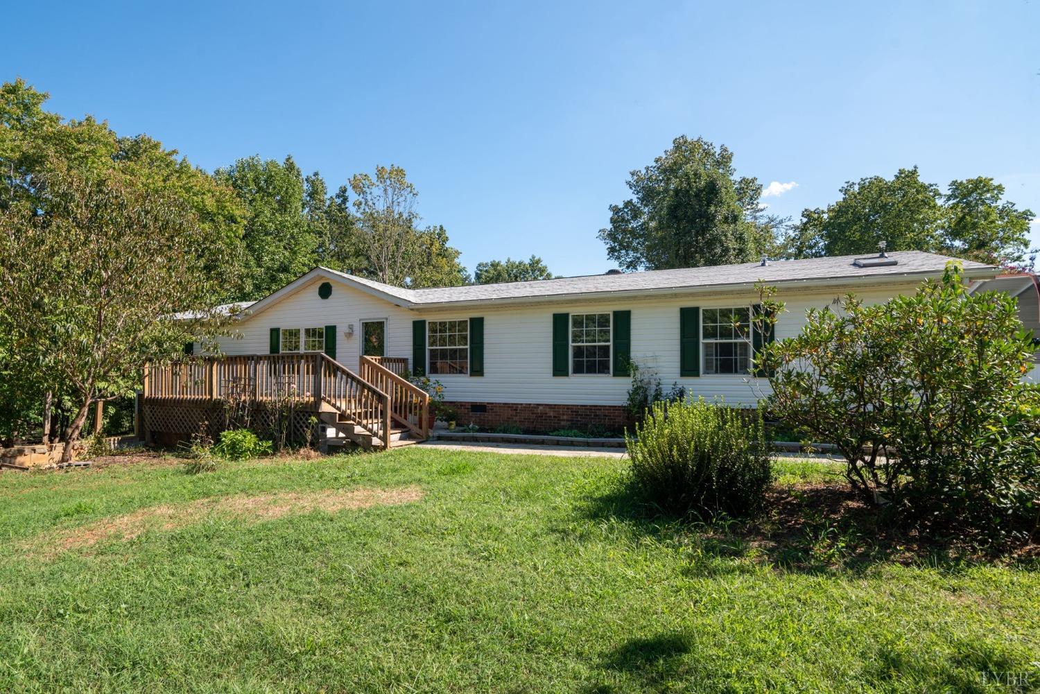 349 Theta Mill Road Gladys, VA 24554 - Photo 1 of 48 a view of a house with a yard and sitting area