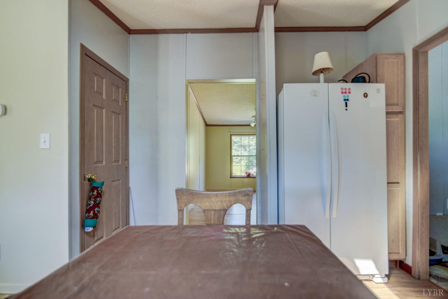 349 Theta Mill Road Gladys, VA 24554 - Photo 13 of 48 a bedroom with a bed and a mirror