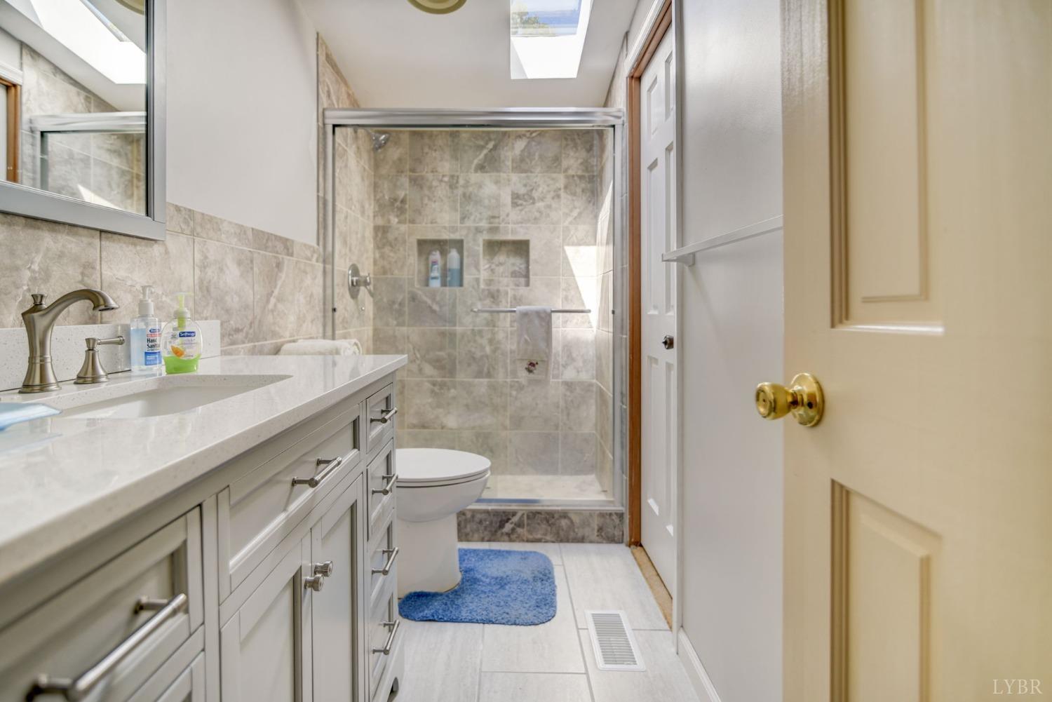 349 Theta Mill Road Gladys, VA 24554 - Photo 21 of 48 a bathroom with a sink a toilet and shower