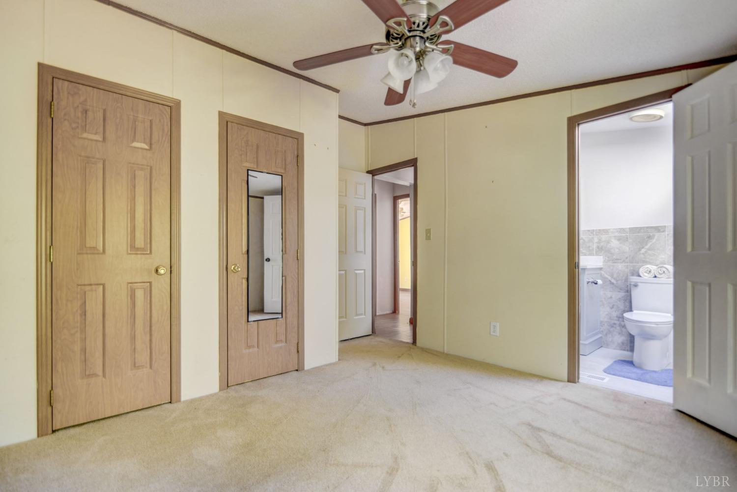 349 Theta Mill Road Gladys, VA 24554 - Photo 23 of 48 an empty room and a bathroom with a mirror