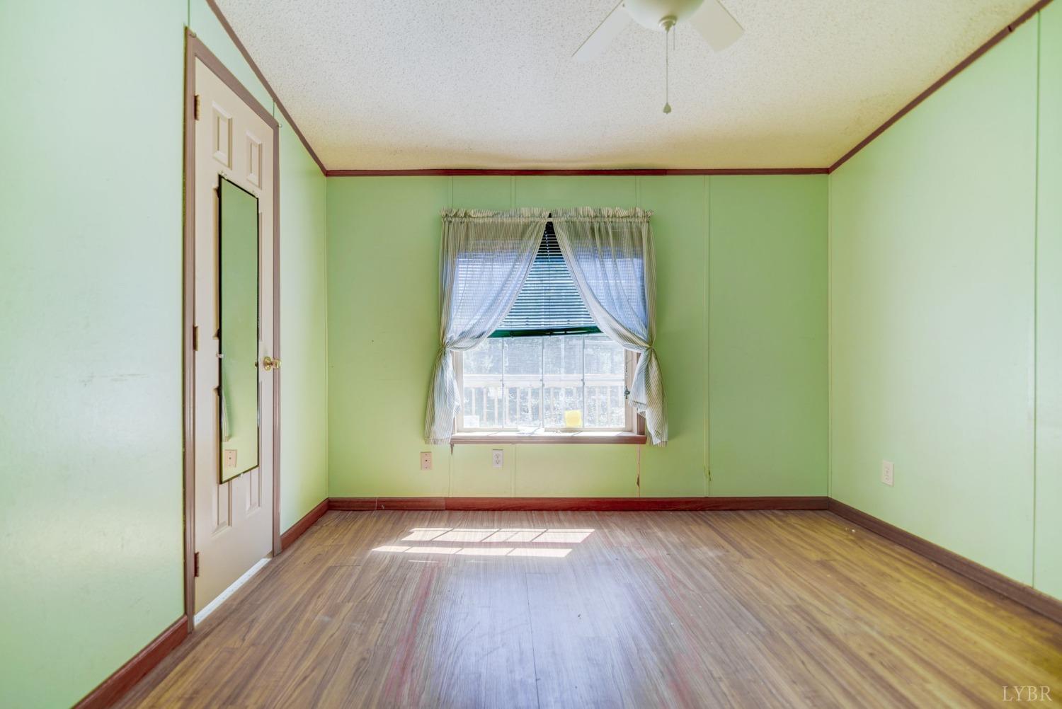 349 Theta Mill Road Gladys, VA 24554 - Photo 24 of 48 a view of a room with wooden floor and window