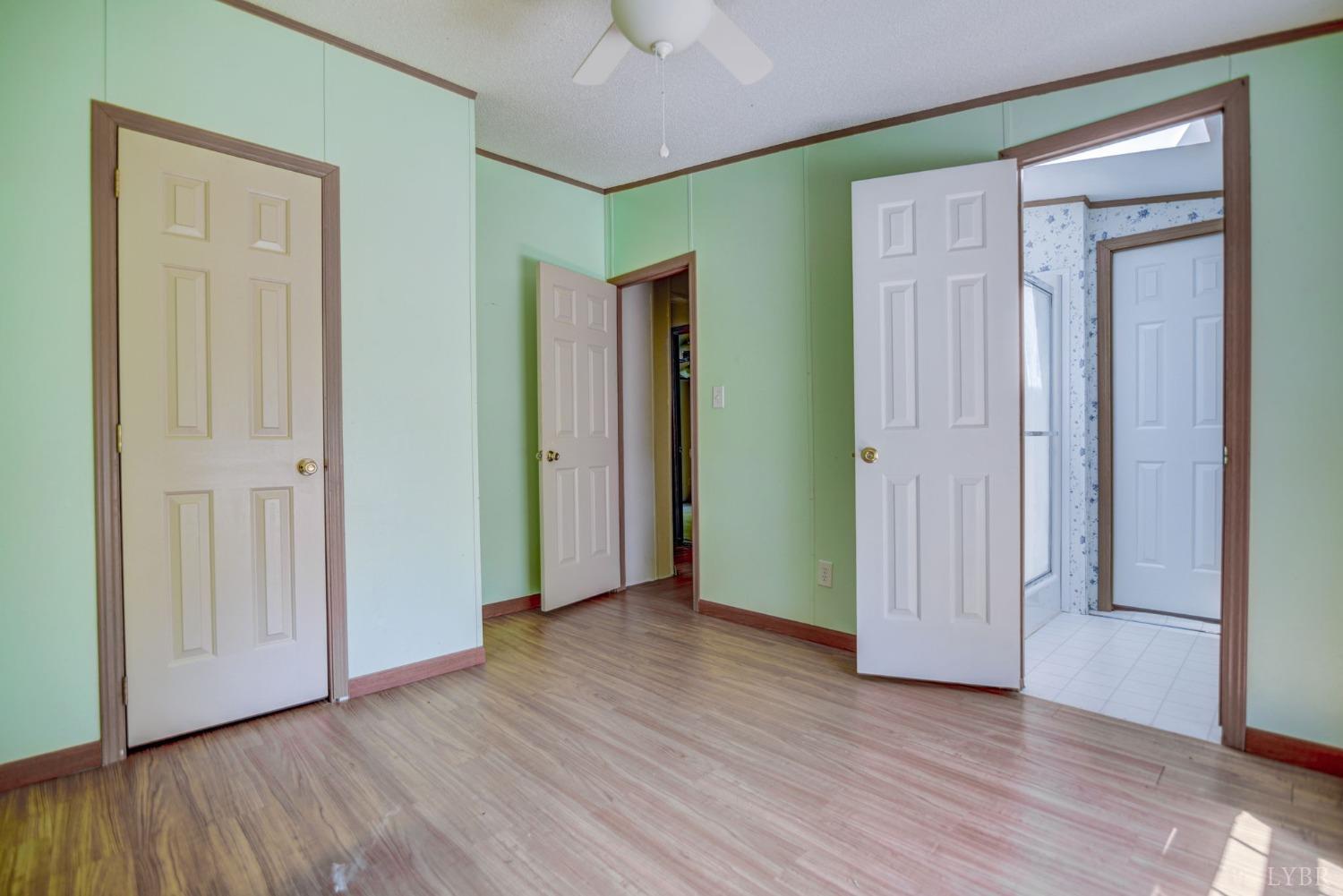 349 Theta Mill Road Gladys, VA 24554 - Photo 25 of 48 an empty room with wooden floor and closet area