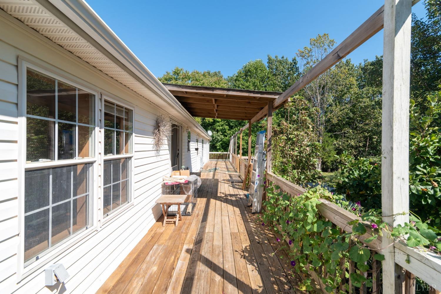 349 Theta Mill Road Gladys, VA 24554 - Photo 28 of 48 a view of balcony with furniture and wooden floor