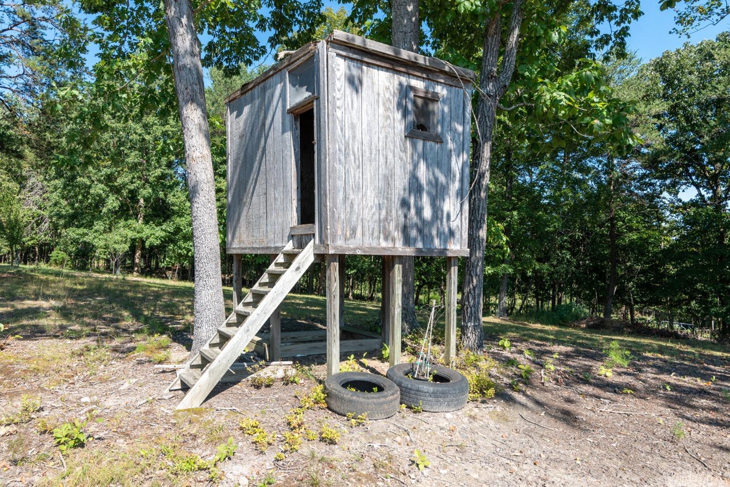 349 Theta Mill Road Gladys, VA 24554 - Photo 38 of 48 a backyard of a house with barbeque oven table and chairs