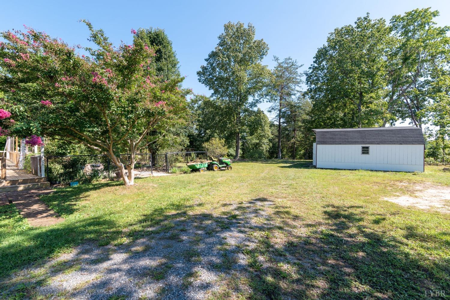 349 Theta Mill Road Gladys, VA 24554 - Photo 41 of 48 a backyard of a house with a yard and tree
