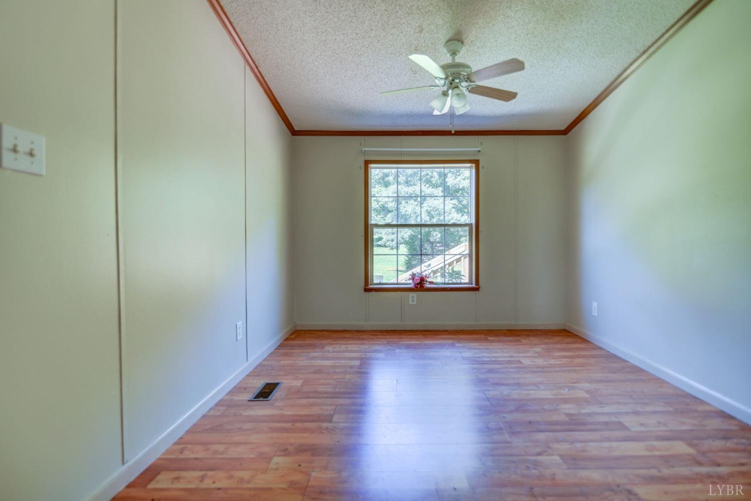 349 Theta Mill Road Gladys, VA 24554 - Photo 5 of 48 wooden floor in an empty room with a window