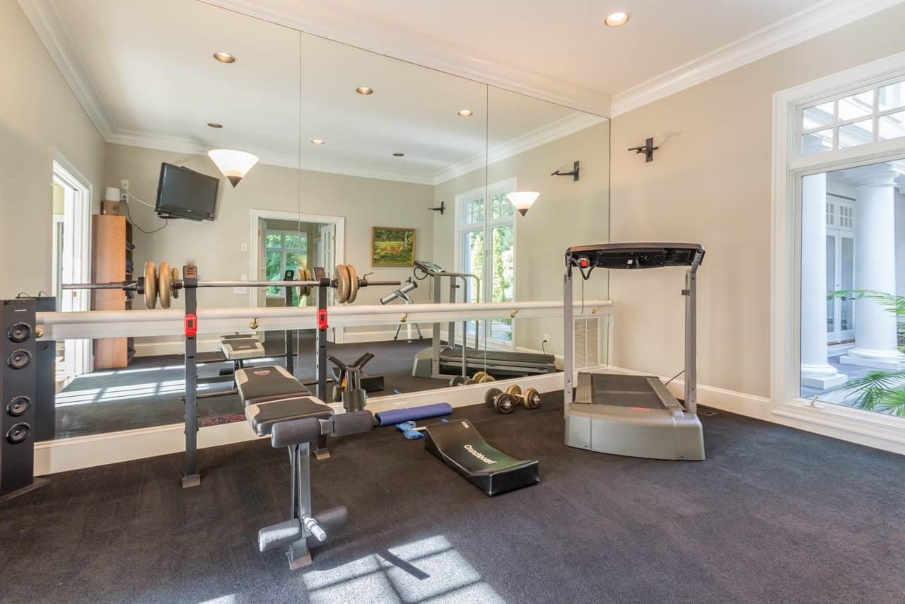 4921 Cremshaw Court Raleigh, NC 27614 - Photo 18 of 25 The Exercise Room is in the East Wing and provides a mirrored wall, wiring for speakers, and a view of the courtyard. Since it adjoins a large 1st floor bedroom, this area could easily be converted to a wonderful, spacious in-law suite. Exercise Room