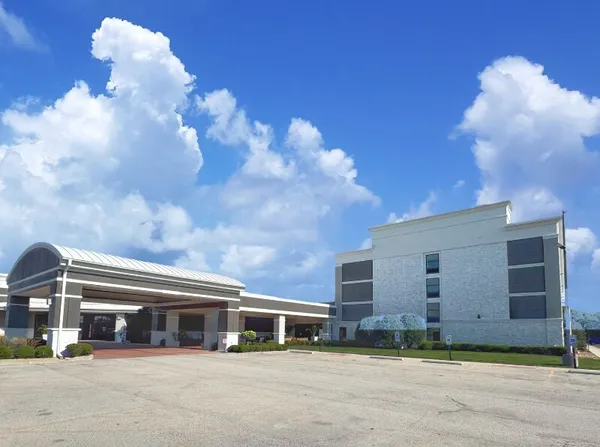 a view of a building with a street