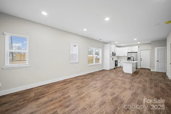 a view of a livingroom with a kitchen