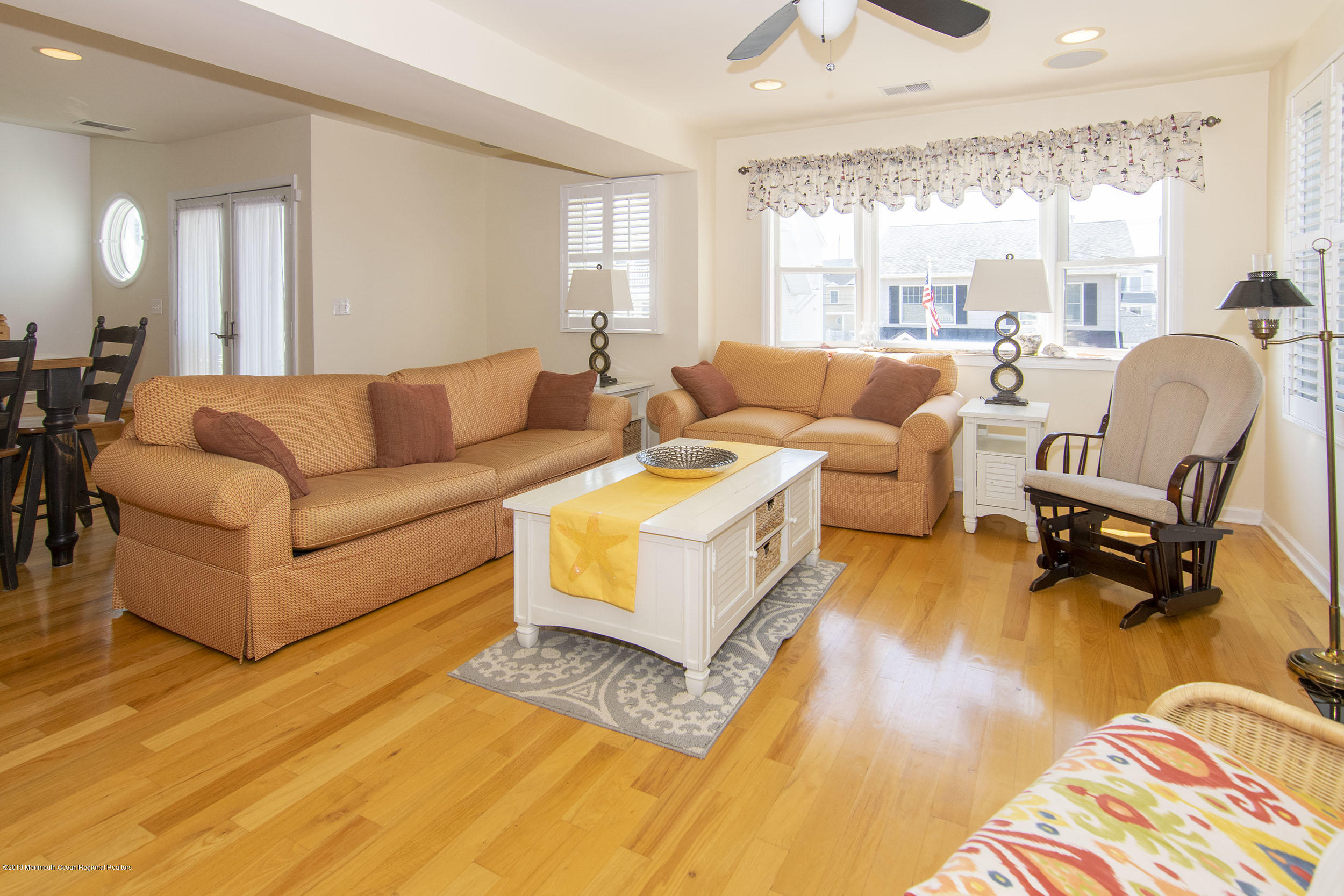 20 Holiday Road Seaside Heights, NJ 08751 - Photo 14 of 42 a living room with furniture and a large window