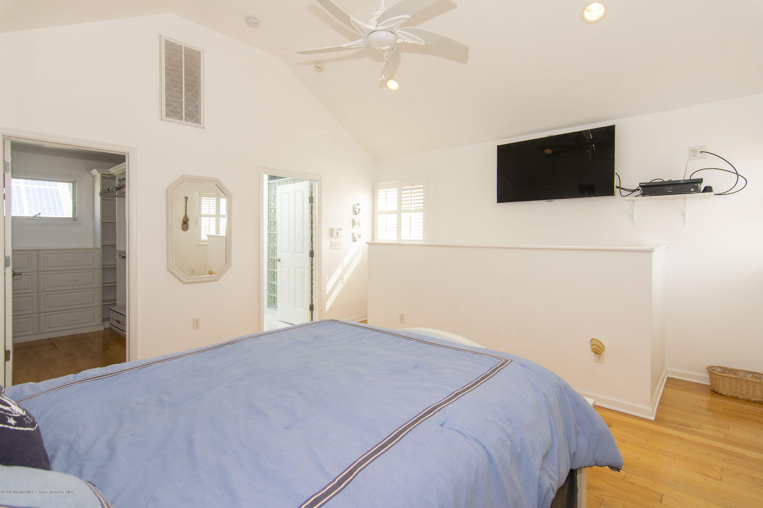 20 Holiday Road Seaside Heights, NJ 08751 - Photo 21 of 42 a bedroom with a bed and a flat screen tv