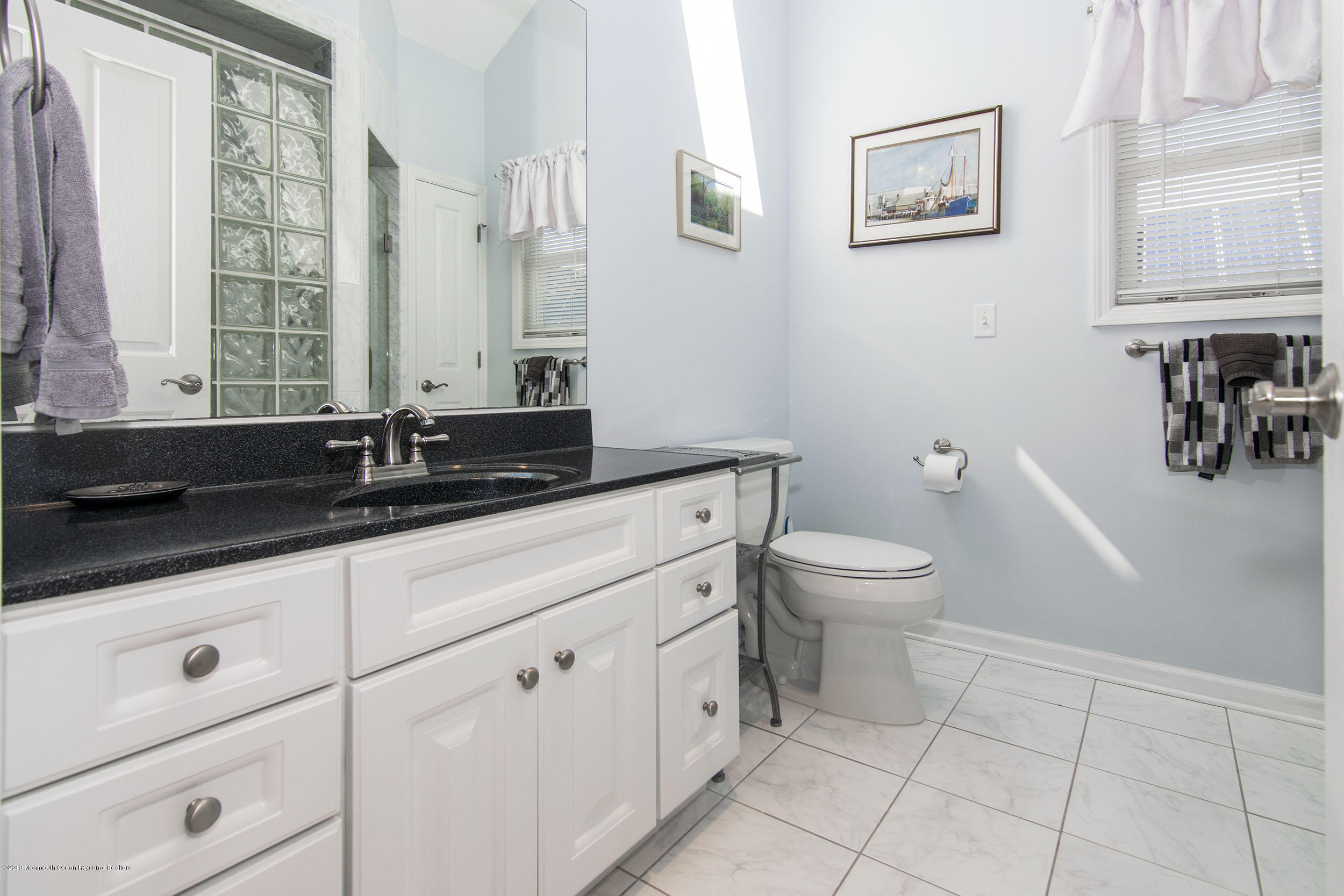 20 Holiday Road Seaside Heights, NJ 08751 - Photo 23 of 42 a bathroom with a granite countertop sink a toilet and a mirror