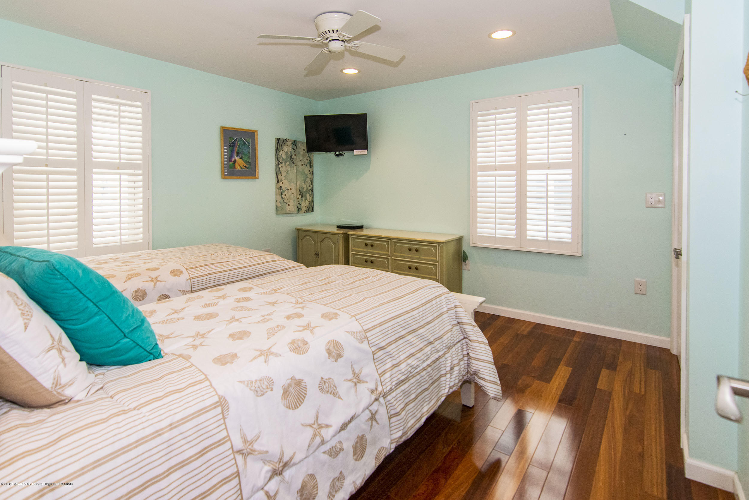 20 Holiday Road Seaside Heights, NJ 08751 - Photo 25 of 42 a bedroom with a large bed and a flat tv screen on dresser