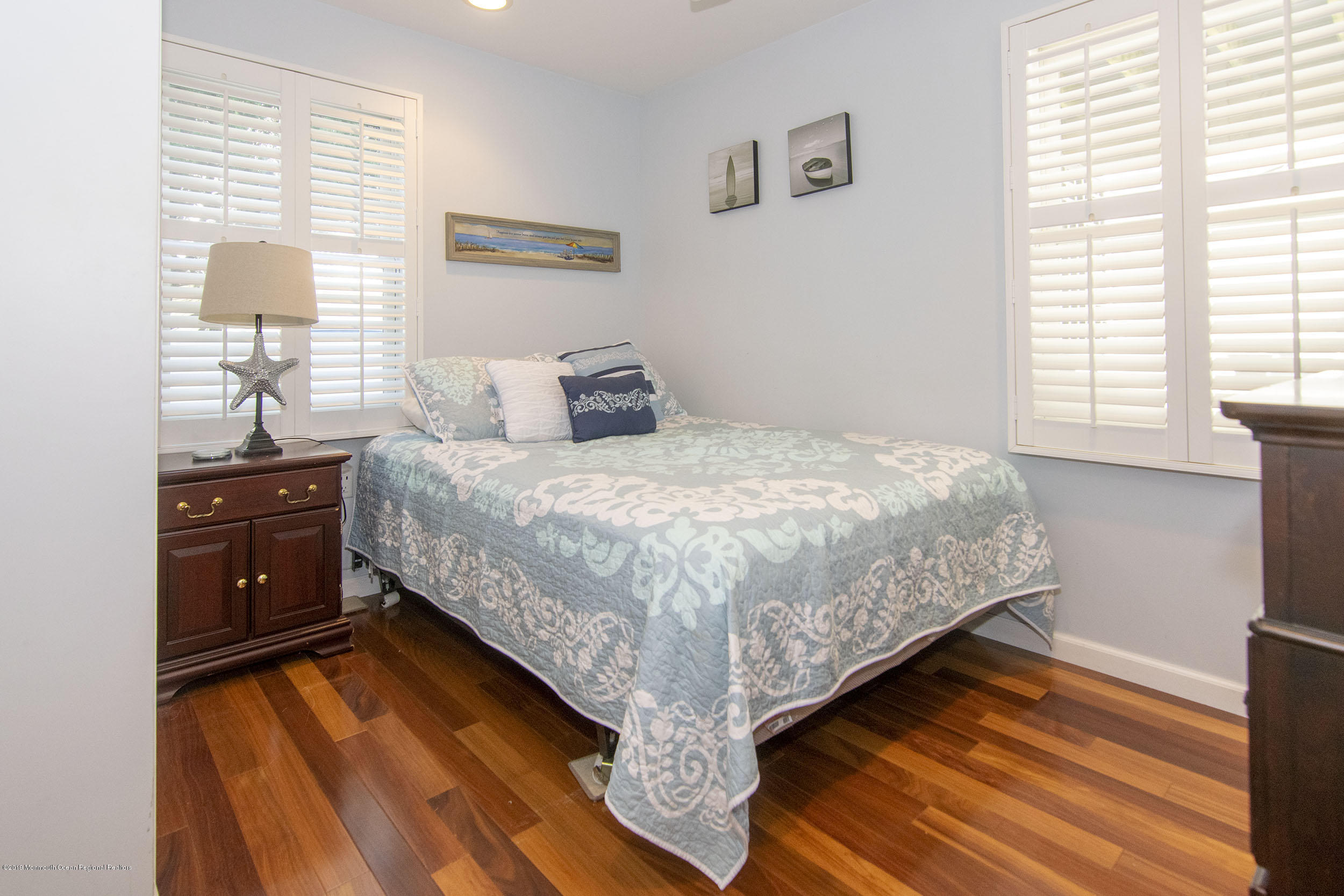 20 Holiday Road Seaside Heights, NJ 08751 - Photo 27 of 42 a bed sitting in a bedroom next to a window