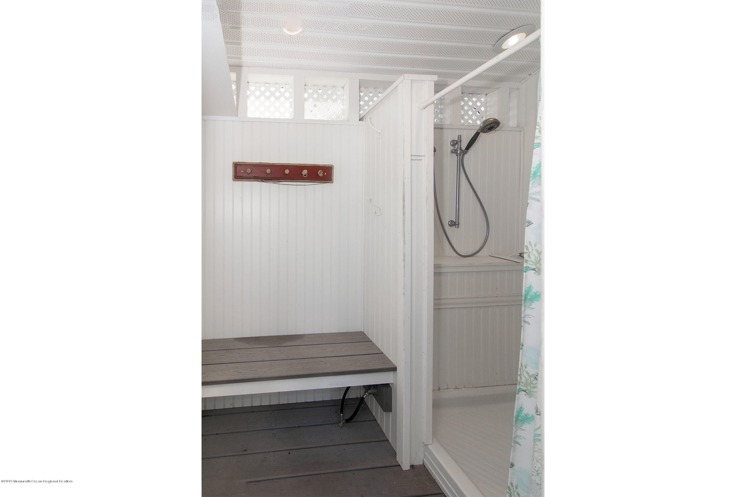 20 Holiday Road Seaside Heights, NJ 08751 - Photo 30 of 42 a bathroom with a glass shower door