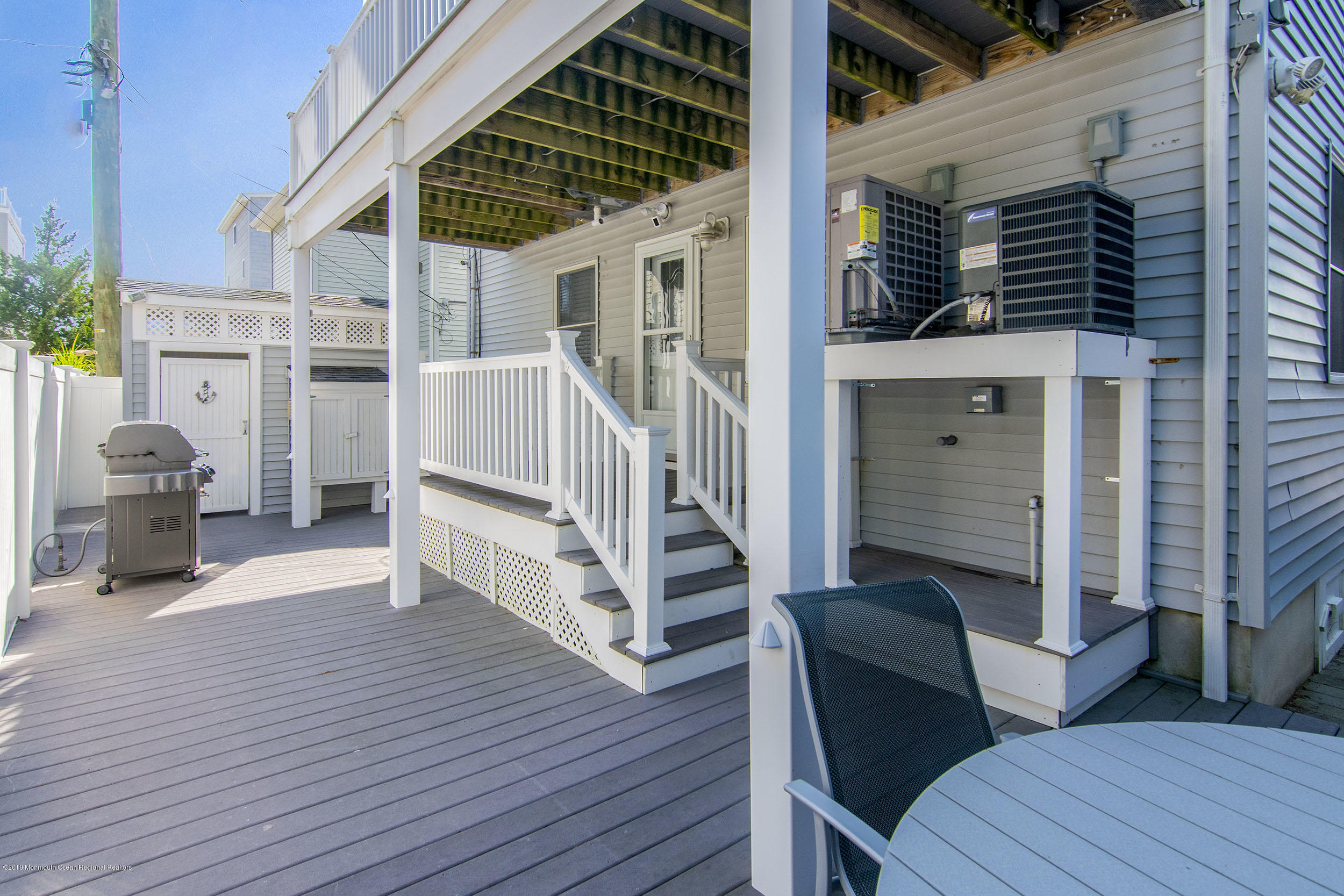 20 Holiday Road Seaside Heights, NJ 08751 - Photo 33 of 42 a view of a patio with a table and chairs