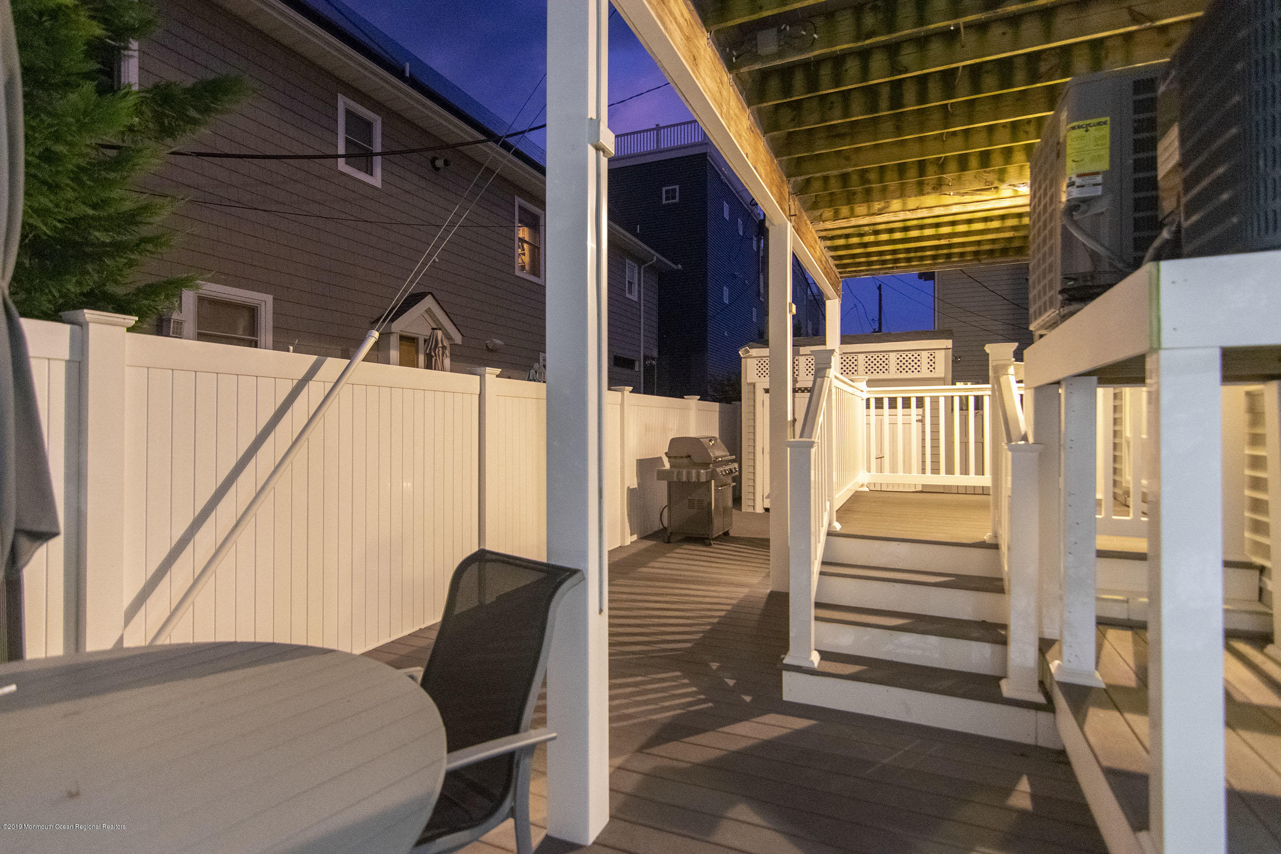 20 Holiday Road Seaside Heights, NJ 08751 - Photo 35 of 42 a view of balcony with two chairs and a large window