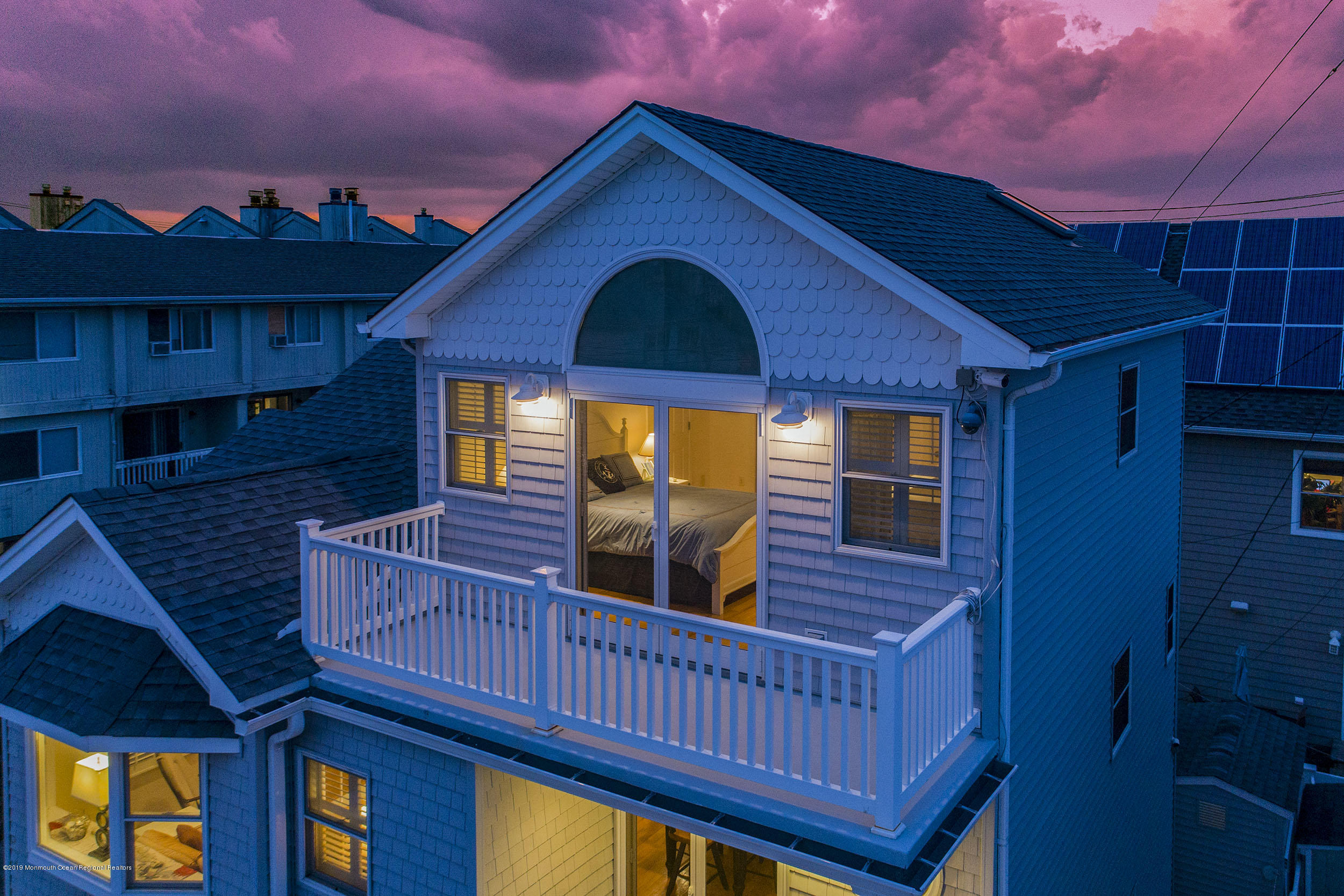 20 Holiday Road Seaside Heights, NJ 08751 - Photo 7 of 42 a view of a balcony with wooden floor and iron fence