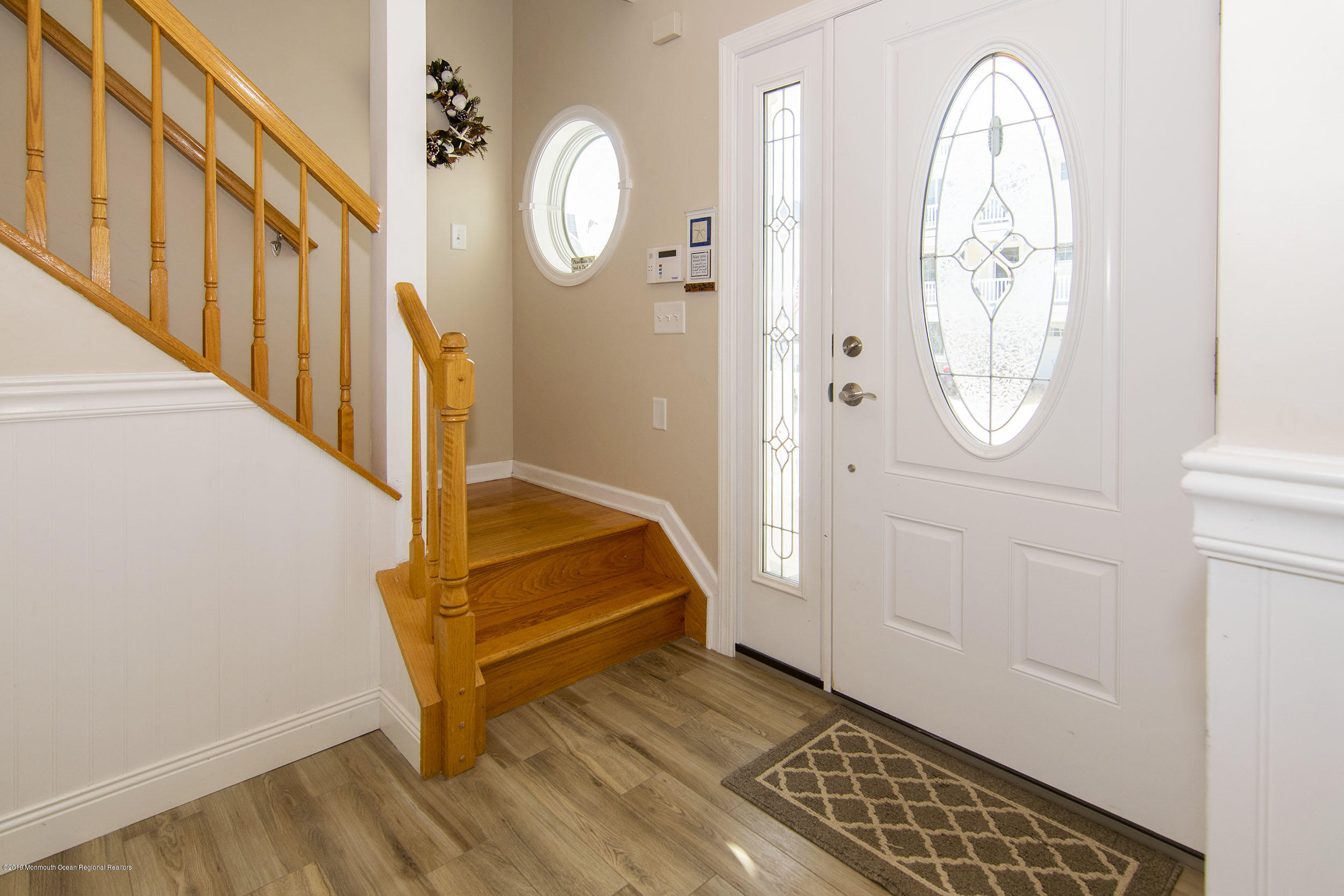 20 Holiday Road Seaside Heights, NJ 08751 - Photo 9 of 42 an empty room with wooden floor mirror and windows