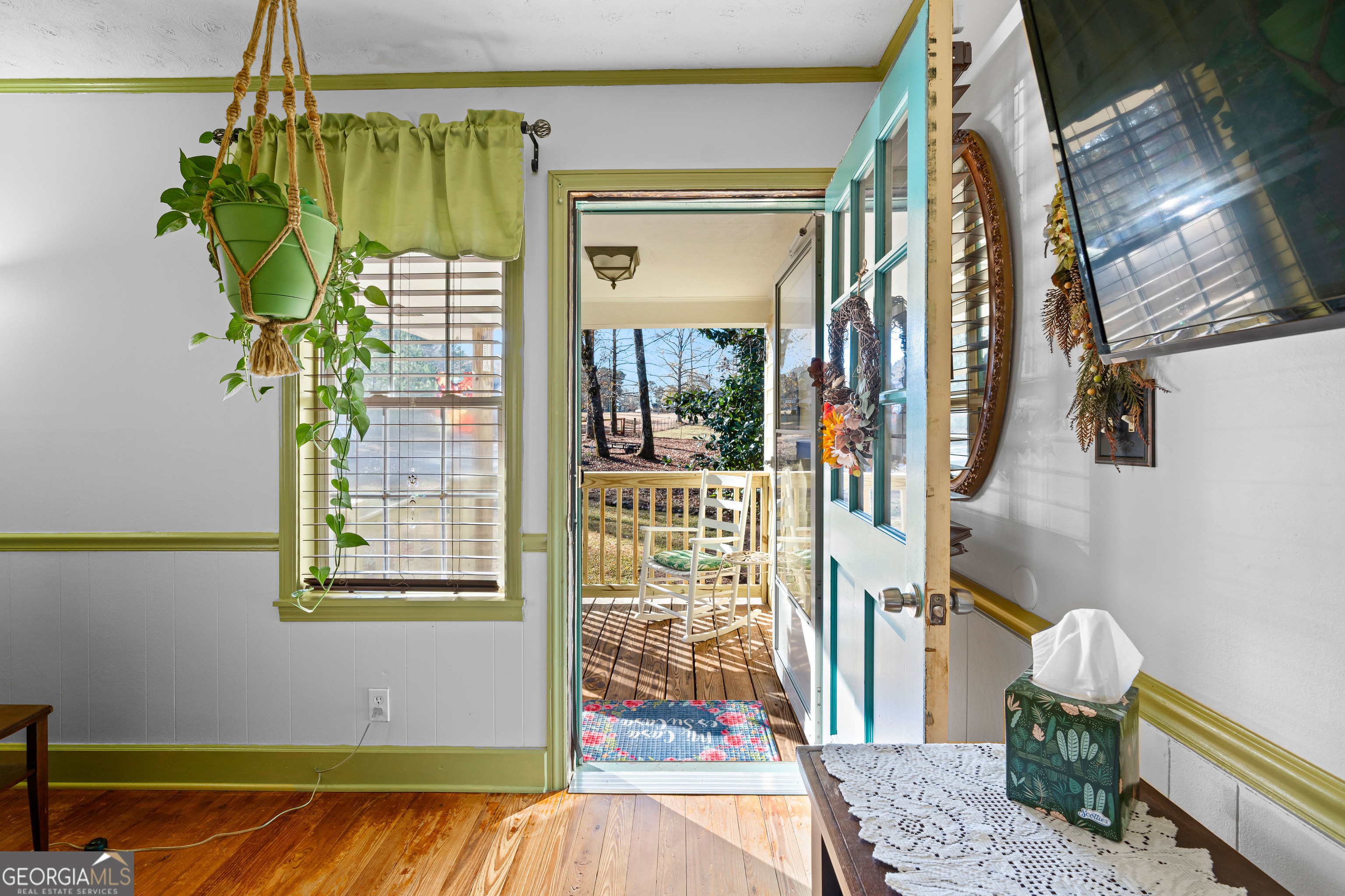 209 Boogers Hill Road Oxford, GA 30054 - Photo 13 of 44 a view of a bedroom with wooden floor and a potted plant
