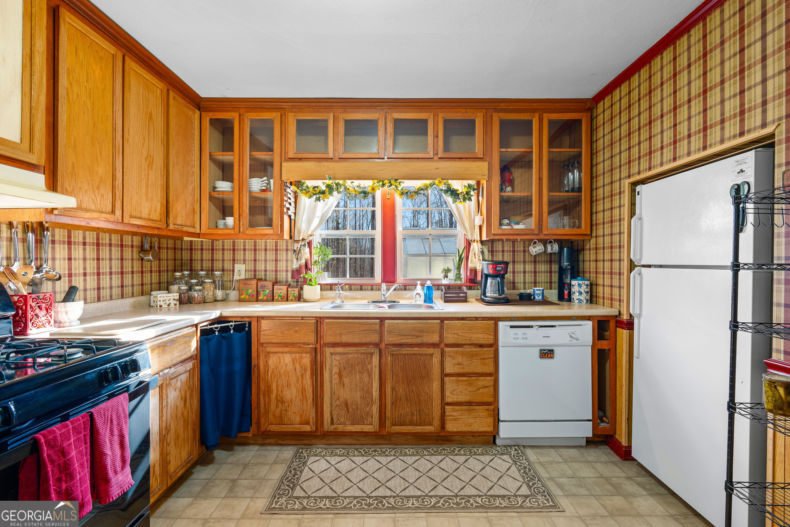 209 Boogers Hill Road Oxford, GA 30054 - Photo 18 of 44 a kitchen with stainless steel appliances granite countertop a stove and a refrigerator