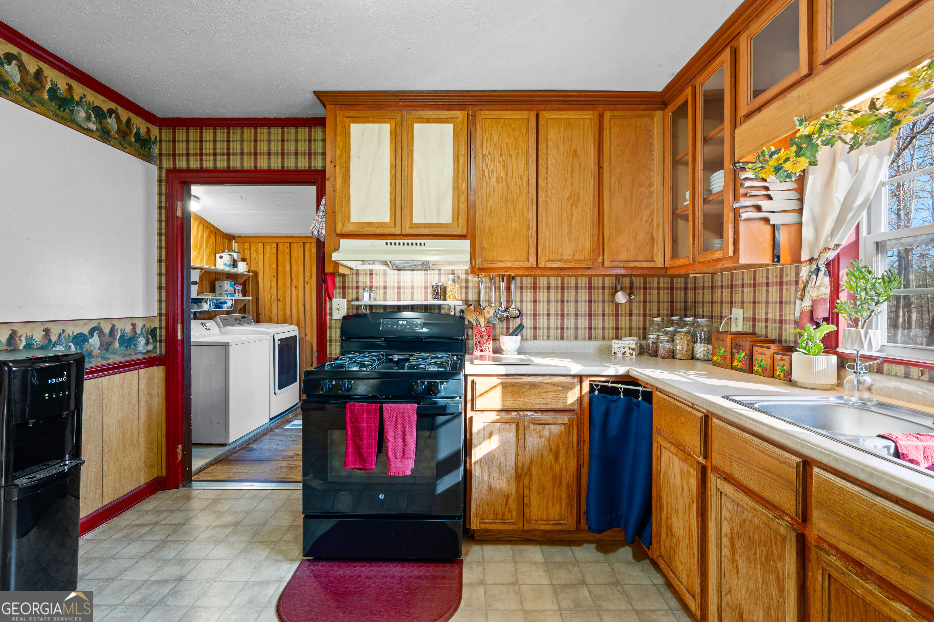 209 Boogers Hill Road Oxford, GA 30054 - Photo 19 of 44 a kitchen with stainless steel appliances granite countertop a stove a sink and a microwave