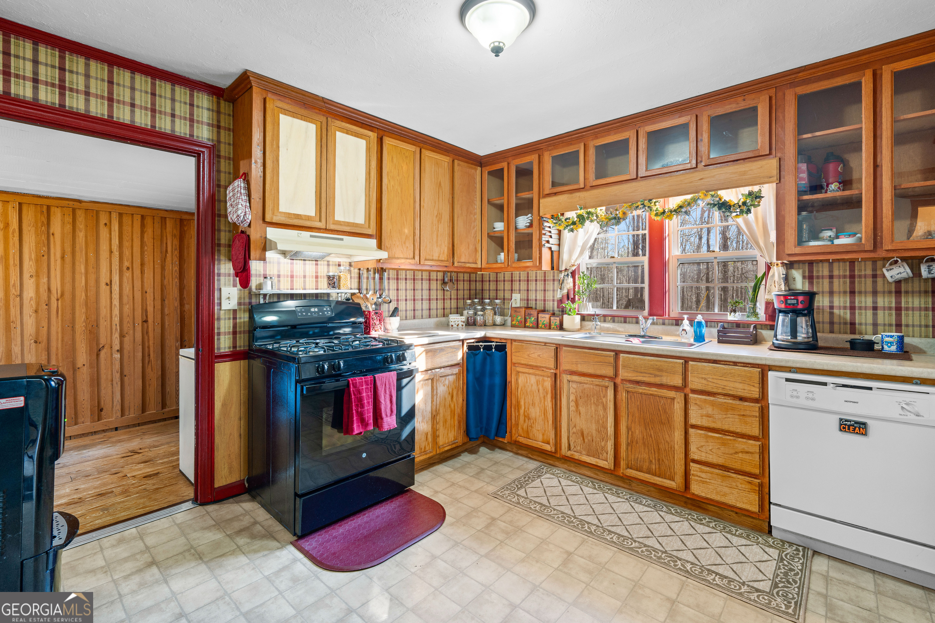 209 Boogers Hill Road Oxford, GA 30054 - Photo 20 of 44 a kitchen with stainless steel appliances granite countertop a stove a sink and a refrigerator