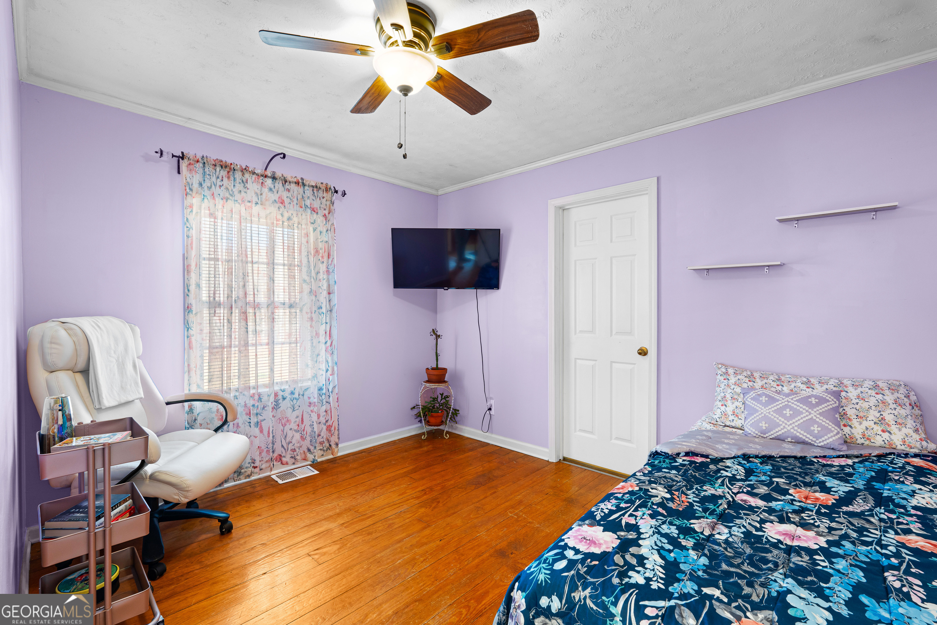 209 Boogers Hill Road Oxford, GA 30054 - Photo 29 of 44 a bedroom with a bed and wooden floor