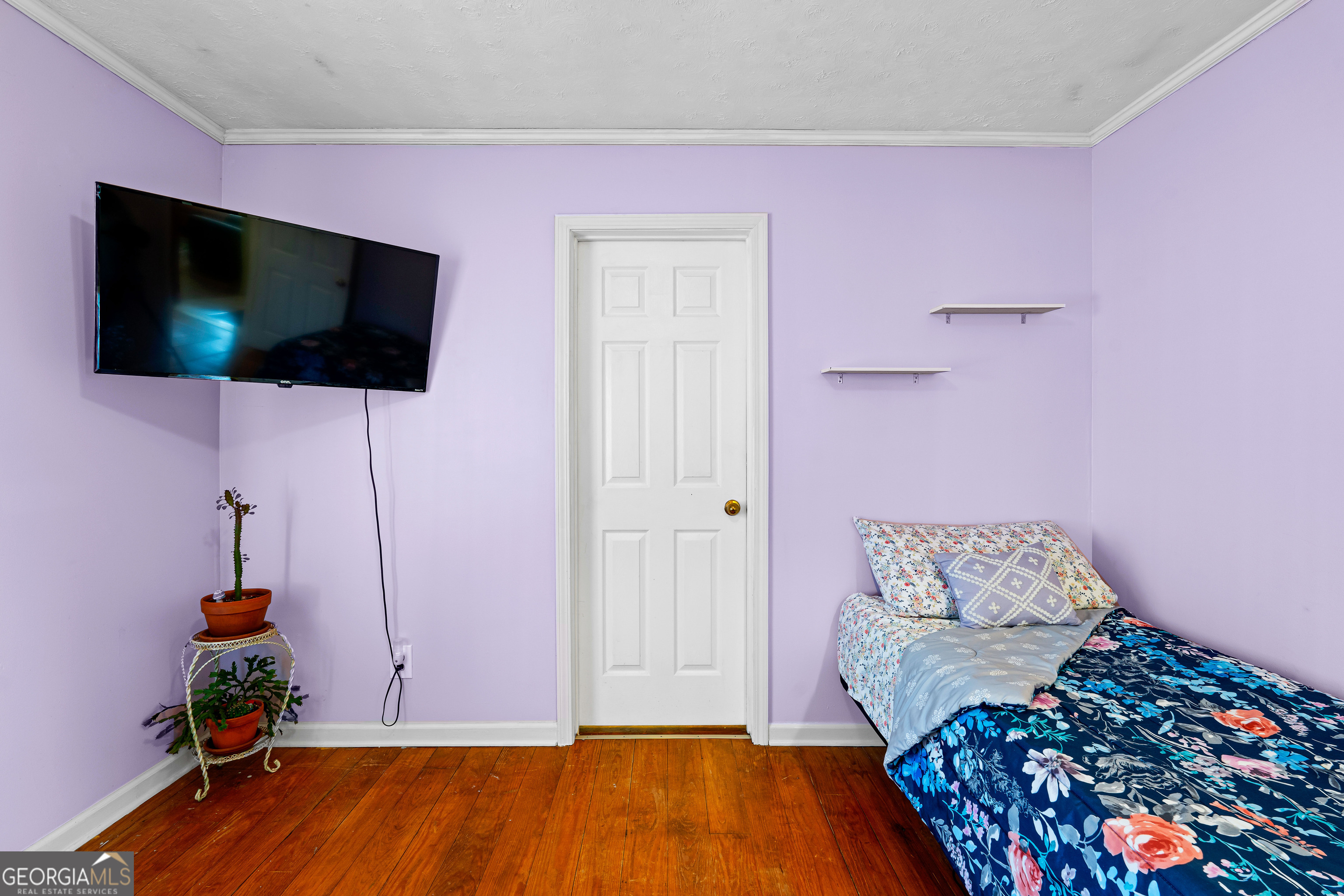 209 Boogers Hill Road Oxford, GA 30054 - Photo 30 of 44 a living room with a flat screen tv and a couch