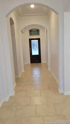 a view of hallway with window and a sink