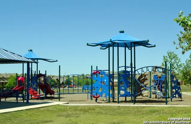 a view of park with swings