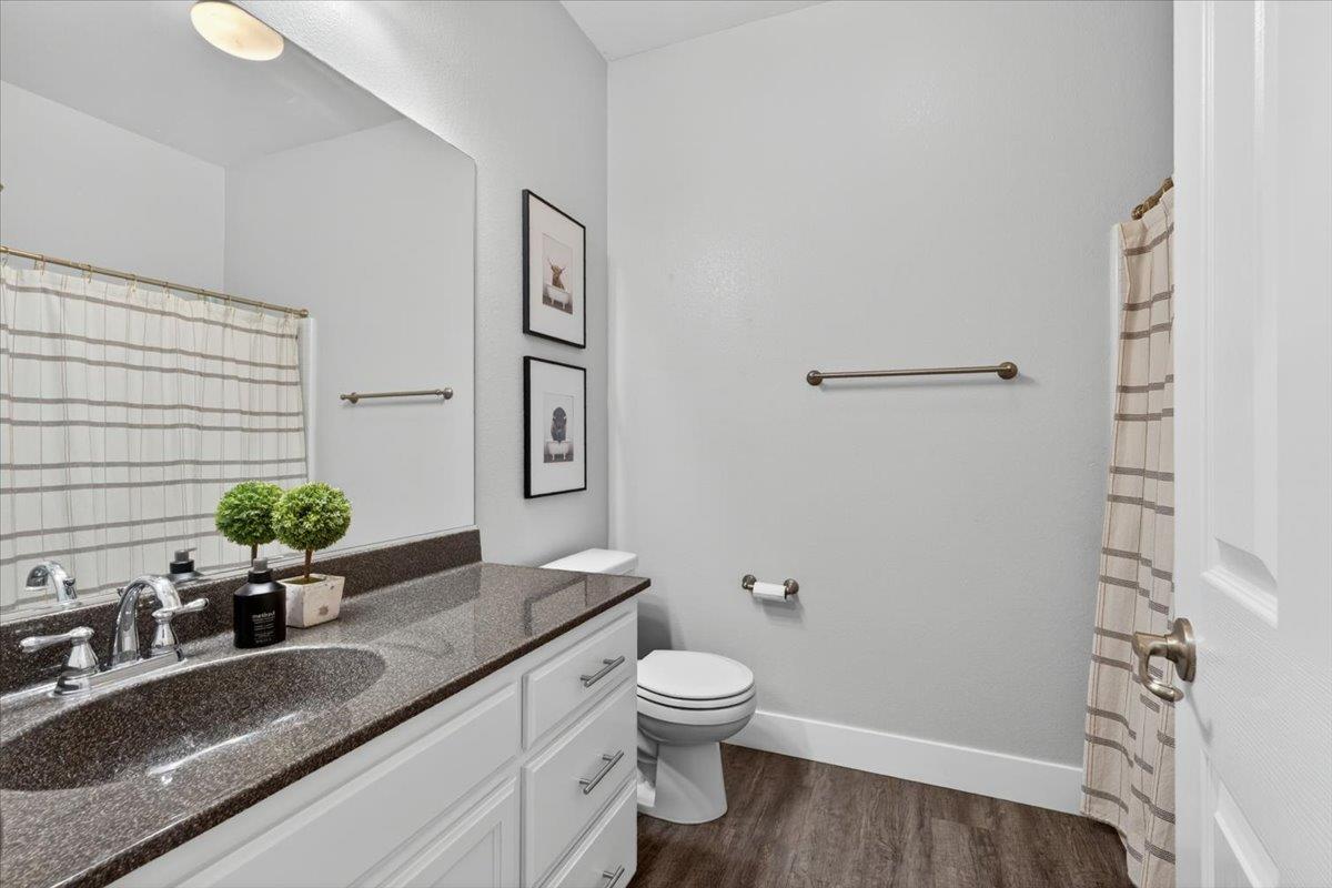 437 Silver Ridge Court Oakdale, CA 95361 - Photo 25 of 41 a bathroom with a granite countertop sink toilet and shower