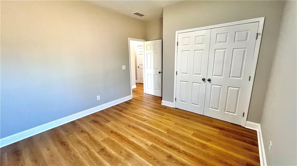 23 S Road Griffin, GA 30224 - Photo 22 of 32 a view of an empty room with wooden floor