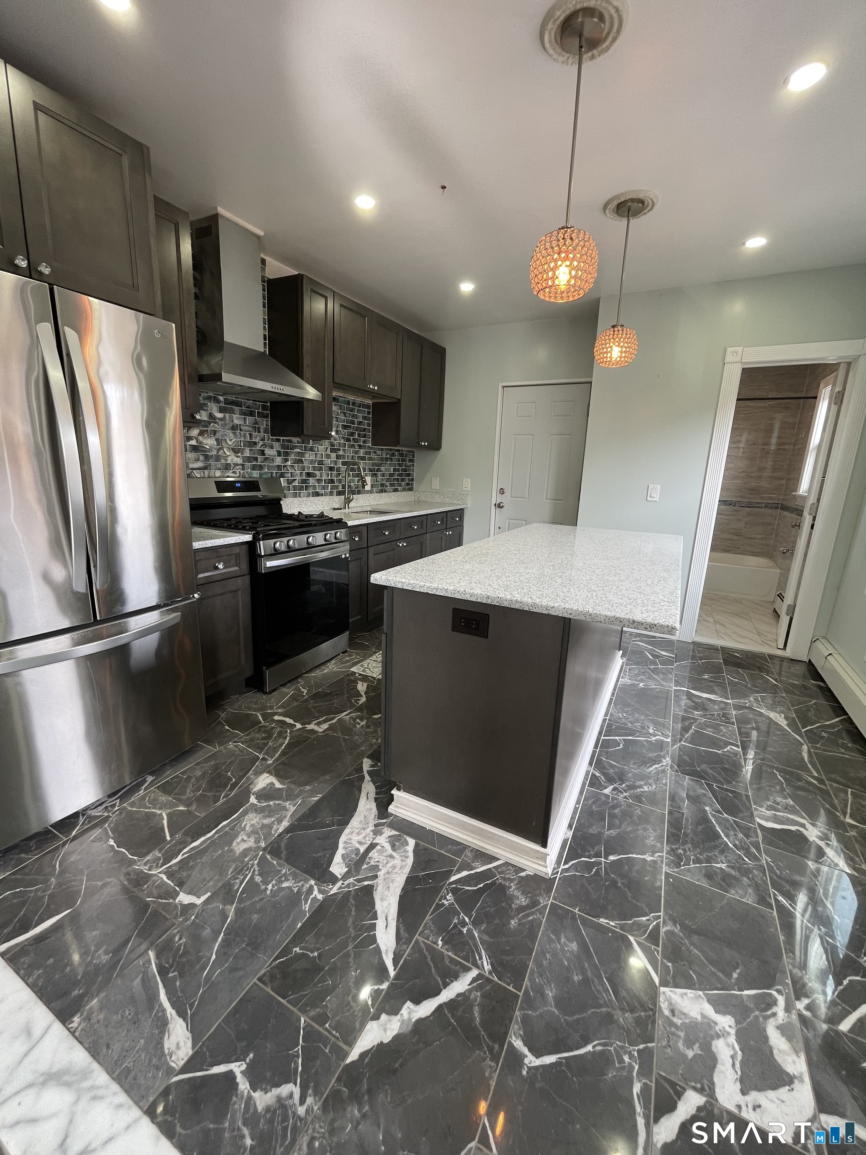 176 Pearl Street Waterbury, CT 06704 - Photo 12 of 19 a kitchen with stainless steel appliances granite countertop a refrigerator a sink a stove and a oven