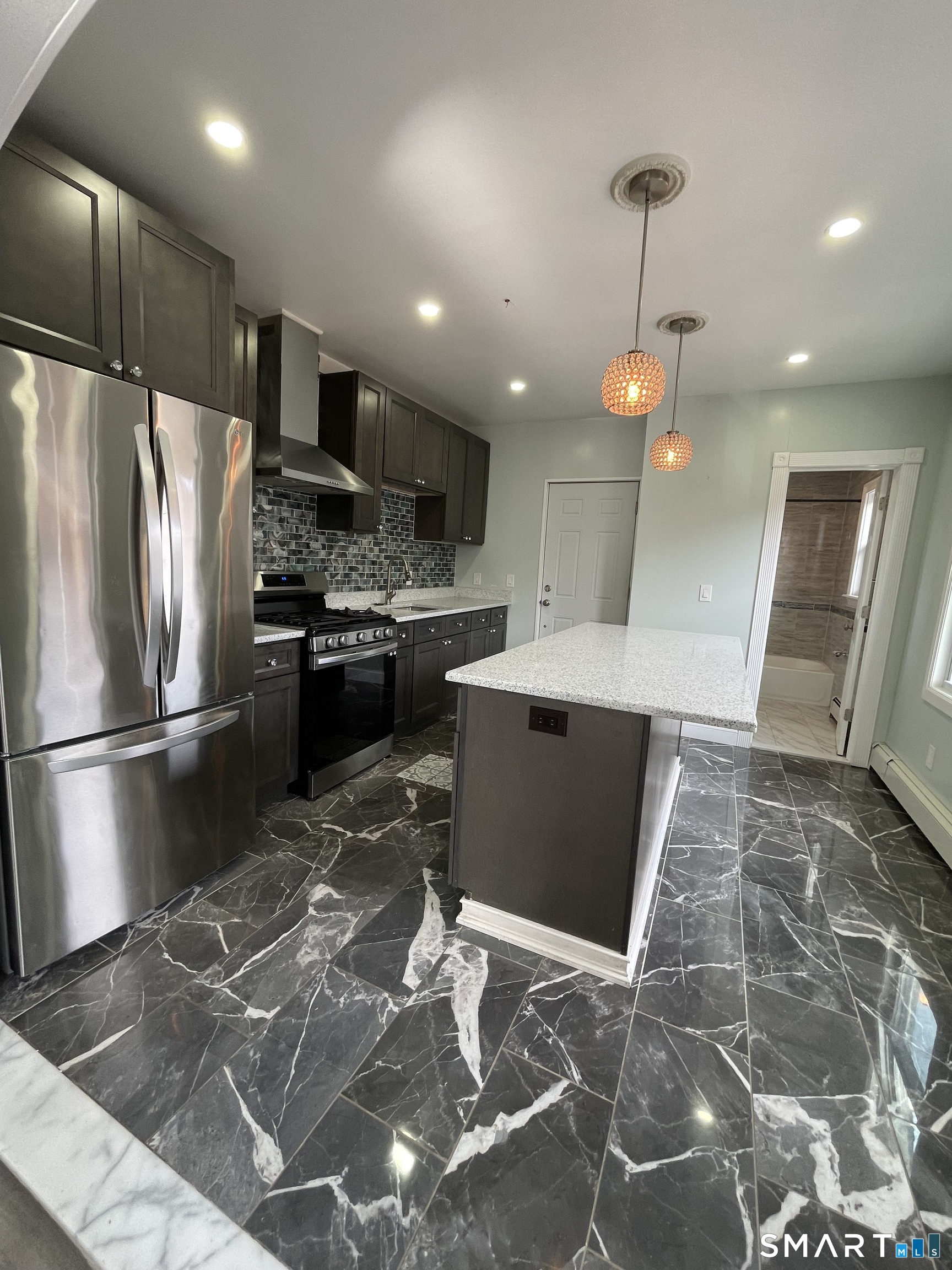 176 Pearl Street Waterbury, CT 06704 - Photo 4 of 19 a kitchen with stainless steel appliances granite countertop a refrigerator a stove a sink and a oven
