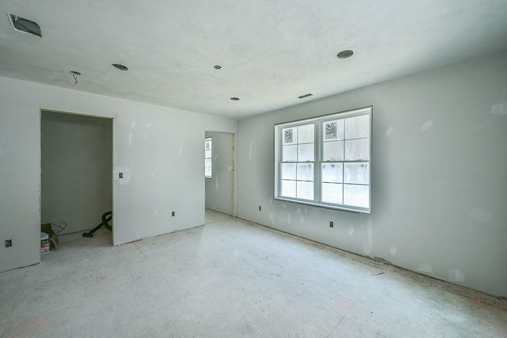 86 Ramshorn Road Dudley, MA 01571 - Photo 14 of 33 a view of an empty room with a window