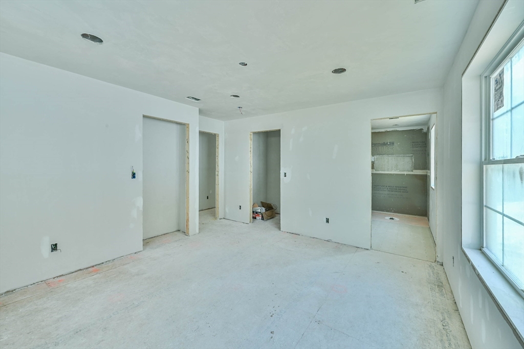 86 Ramshorn Road Dudley, MA 01571 - Photo 16 of 33 a view of an empty room with a window