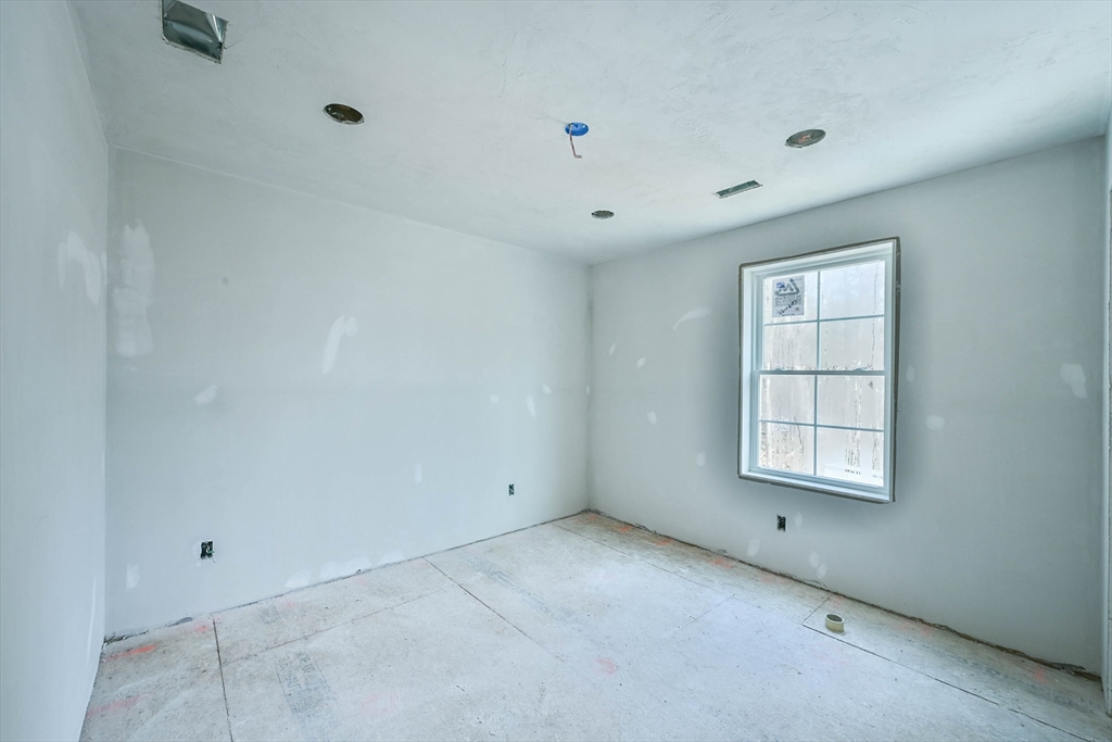86 Ramshorn Road Dudley, MA 01571 - Photo 19 of 33 an empty room with a window