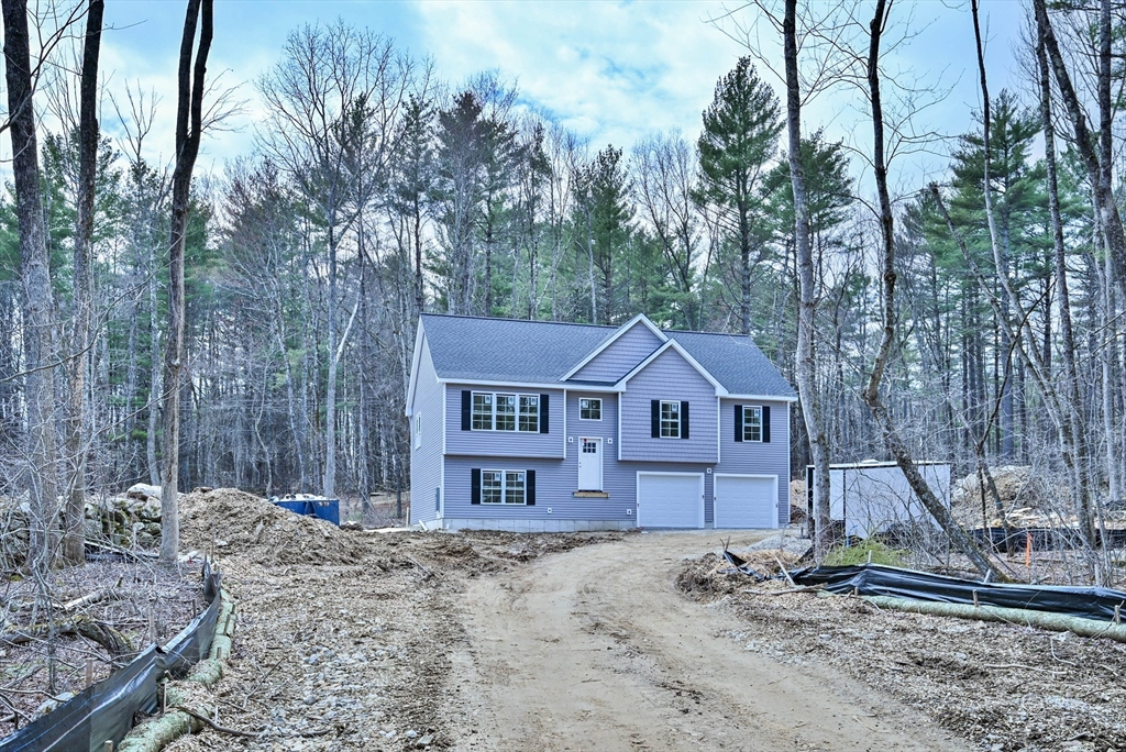 86 Ramshorn Road Dudley, MA 01571 - Photo 2 of 33 a view of a house with a yard covered in snow