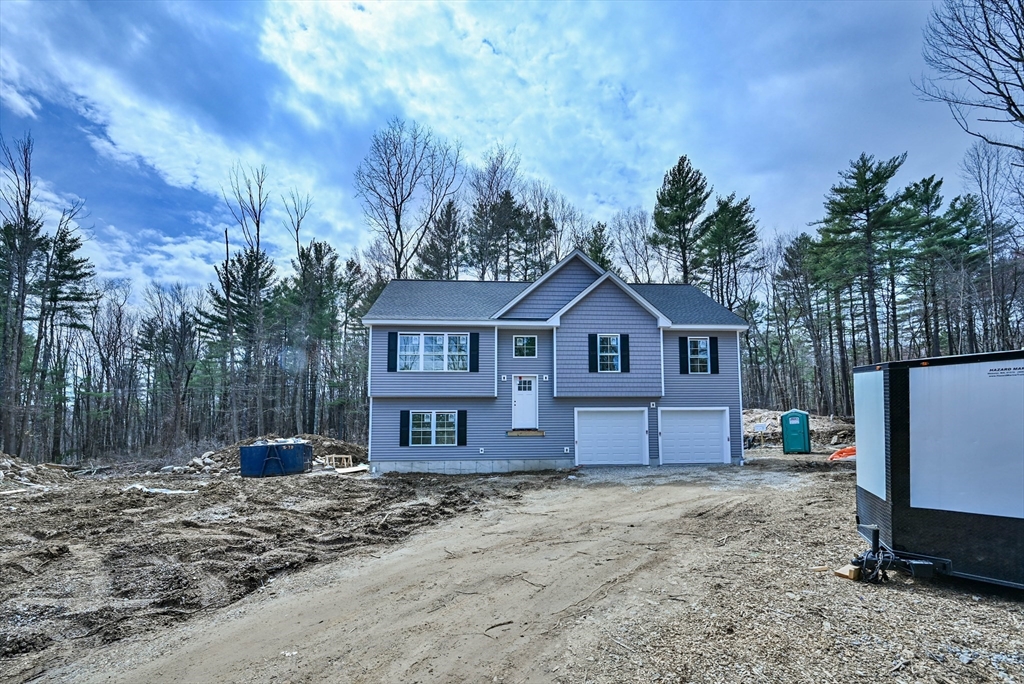 86 Ramshorn Road Dudley, MA 01571 - Photo 3 of 33 a front view of a house with a yard