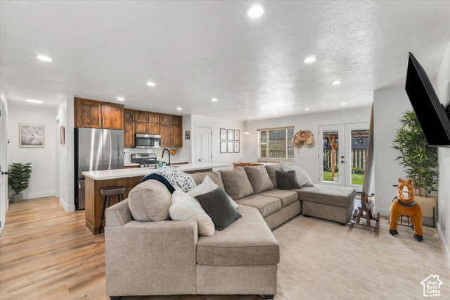 437 Scenic Heights Road Kamas, UT 84036 - Photo 3 of 46 Open-concept living space with wood-finish flooring, recessed lighting, and white walls