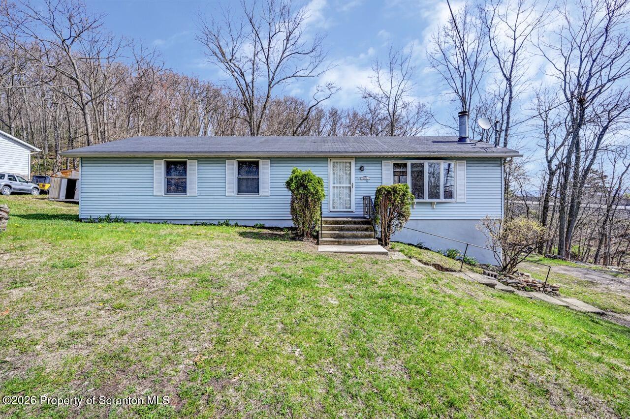 3032 1/2 Division Street Scranton, PA 18504 - Photo 1 of 49 front view of a house with a yard
