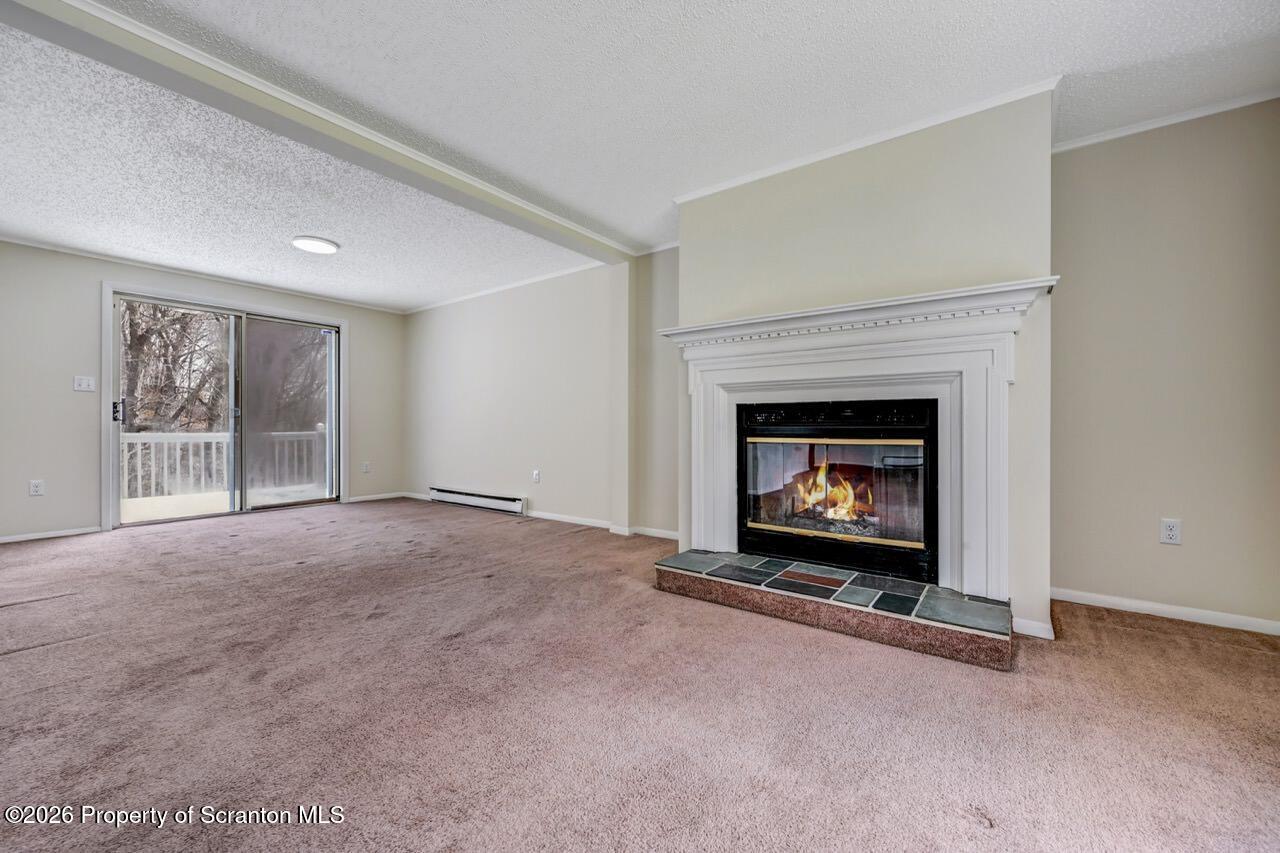 3032 1/2 Division Street Scranton, PA 18504 - Photo 11 of 49 a living room with a fireplace
