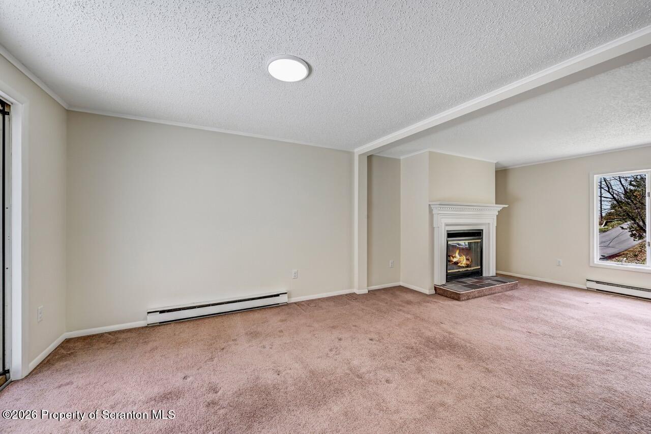 3032 1/2 Division Street Scranton, PA 18504 - Photo 17 of 49 an empty room with fireplace