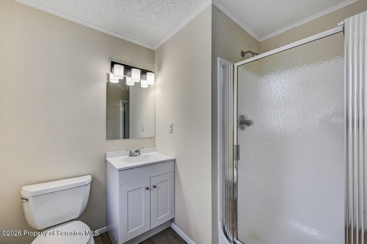 3032 1/2 Division Street Scranton, PA 18504 - Photo 25 of 49 a bathroom with a toilet sink and shower