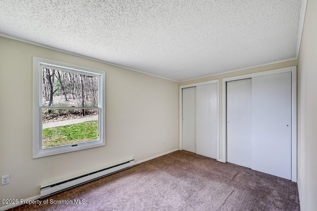 3032 1/2 Division Street Scranton, PA 18504 - Photo 28 of 49 a view of an empty room with a window