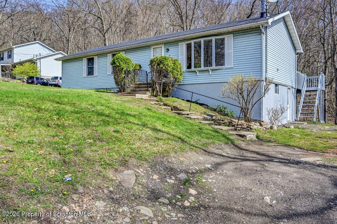 3032 1/2 Division Street Scranton, PA 18504 - Photo 3 of 49 a view of house with a yard