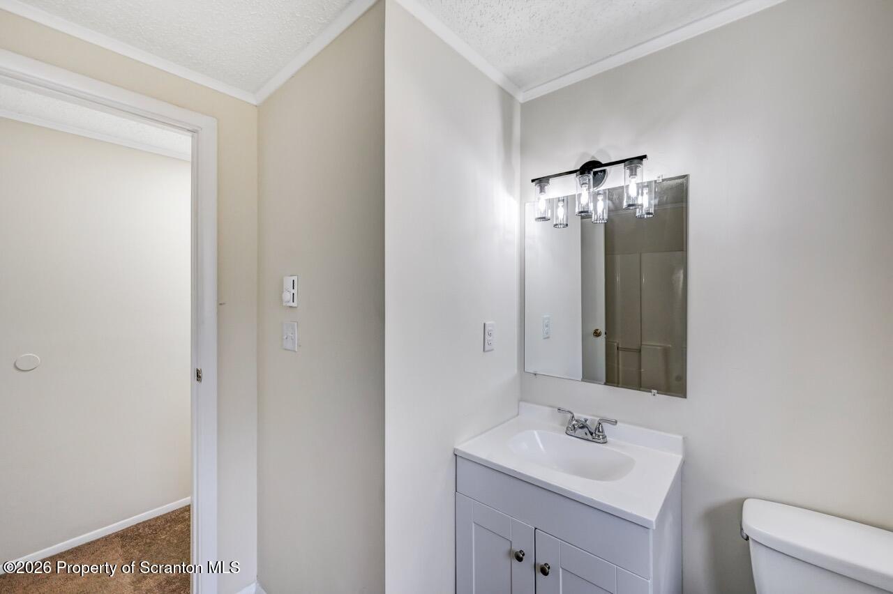 3032 1/2 Division Street Scranton, PA 18504 - Photo 31 of 49 a bathroom with a sink and a mirror